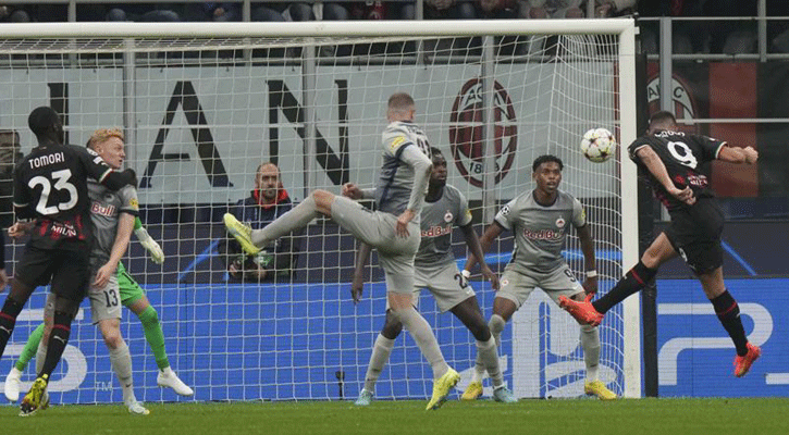 Giroud double helps AC Milan secure last-16 place
