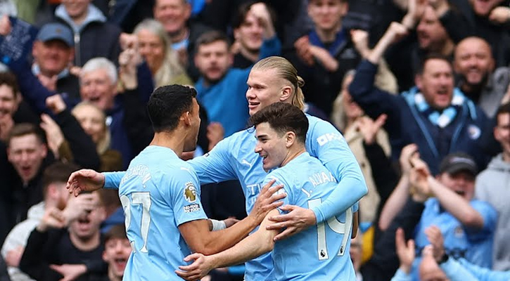 Man City thrash Luton to go top of table