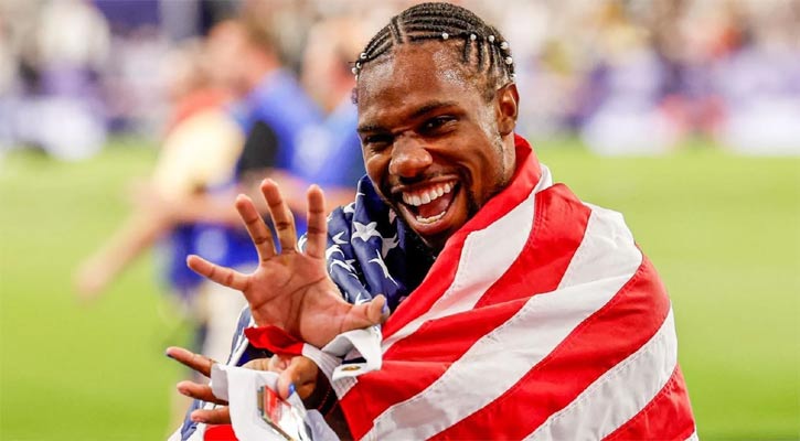 Lyles wins sensational 100m gold by 0.005 seconds
